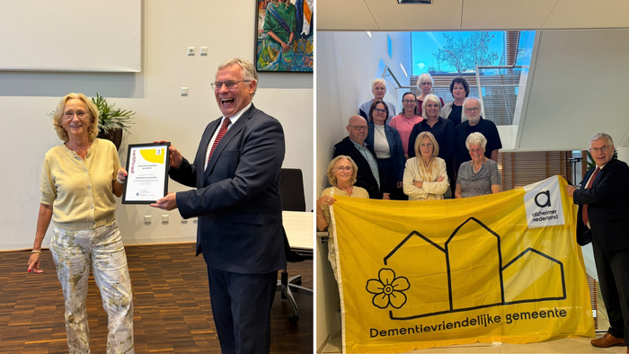 Marc Budel neemt certificaat in ontvangst