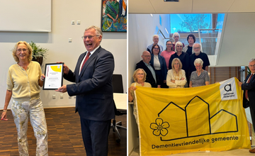 Marc Budel neemt certificaat in ontvangst